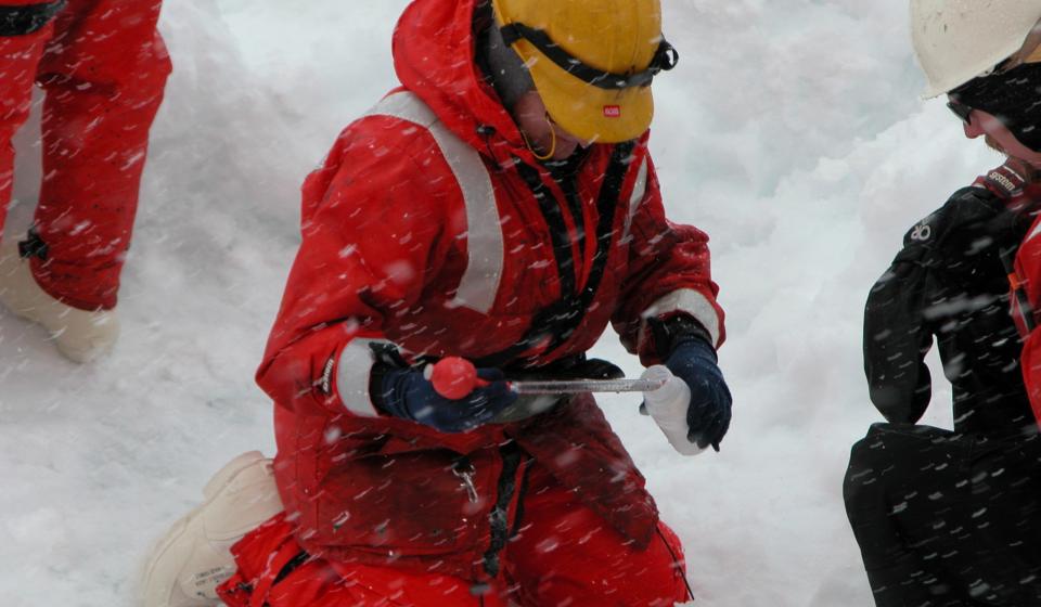 Researchers taking samples of the snow