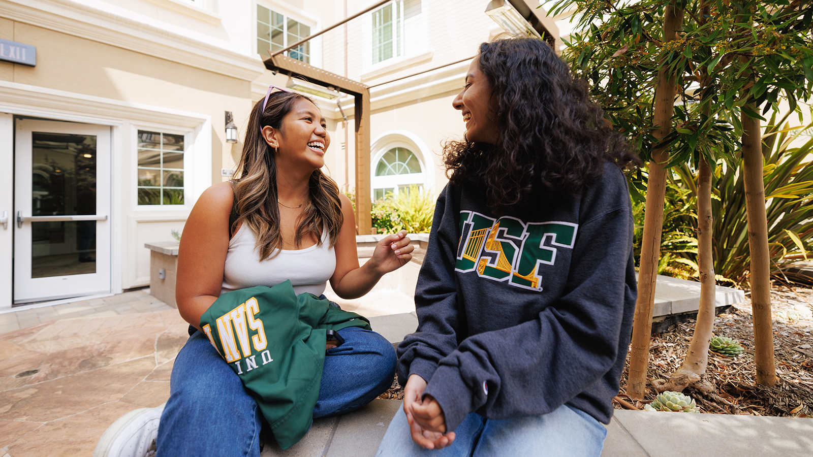 two students talking outside on usf campus