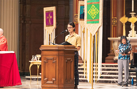 Student speaking at mass