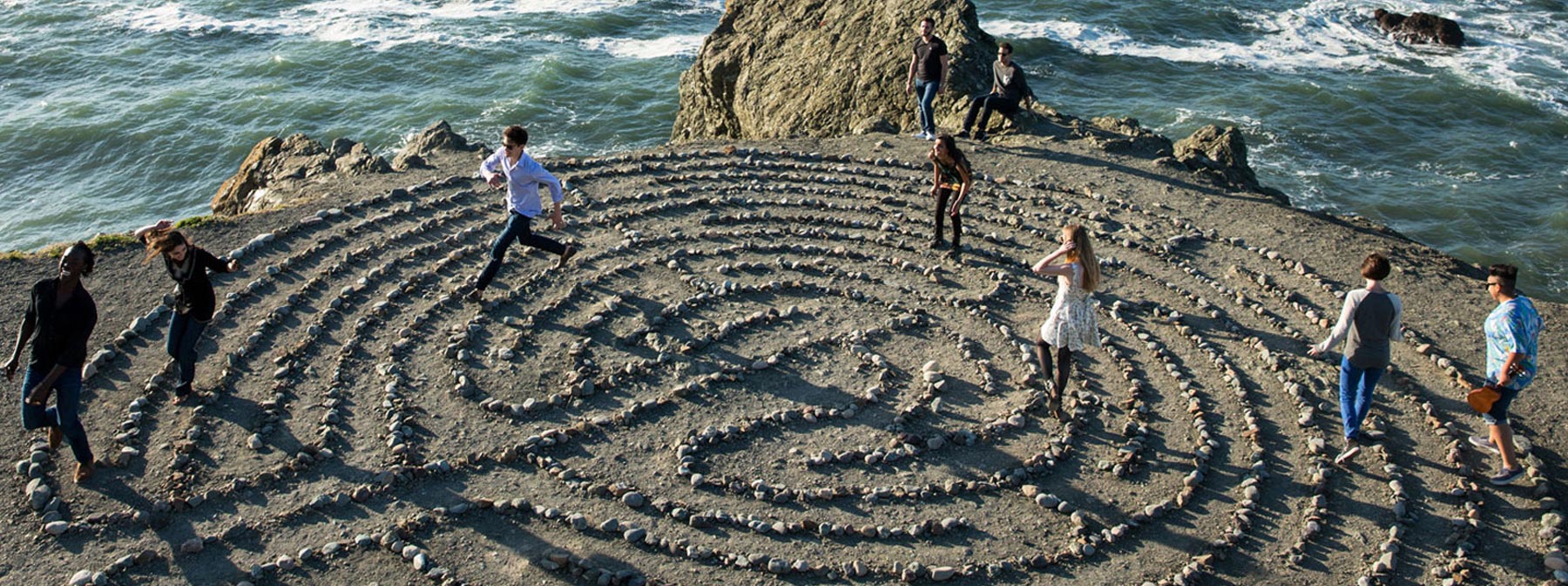 Students running through the stone maze at SF's Land's End park