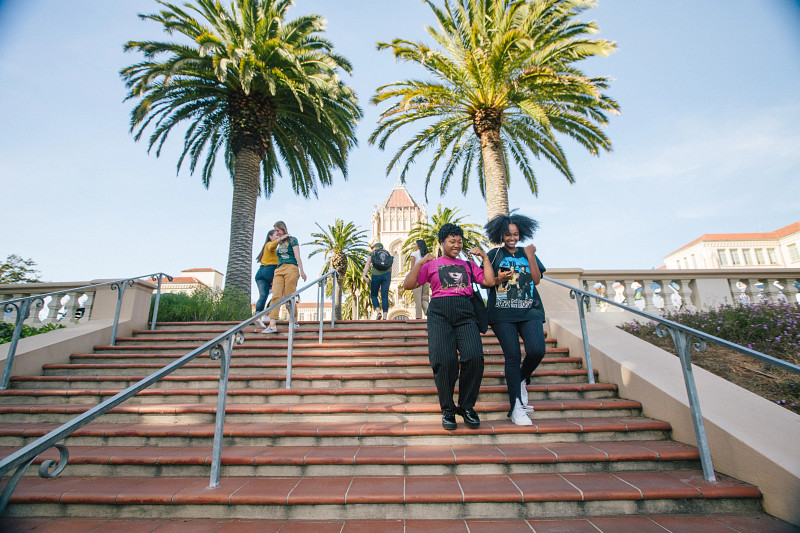 students walking down spanish steps on campus