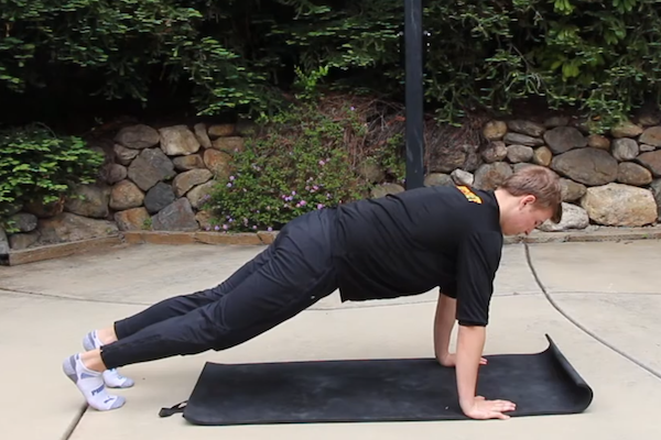 trainer performing push up