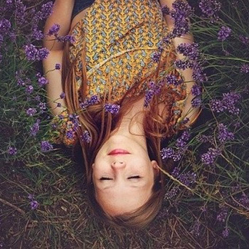 A person lays down and looks relaxed.