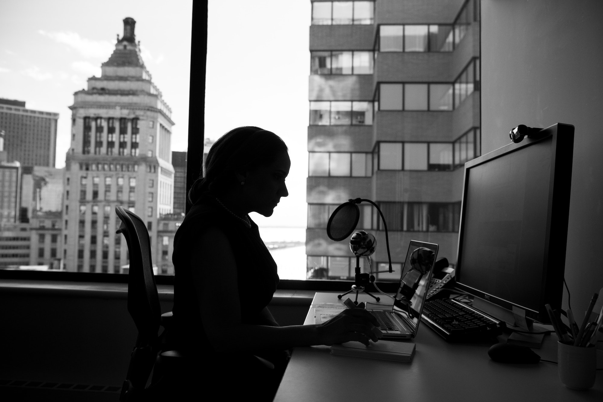 Person in an office working on a laptop