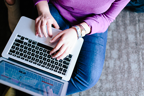 Student sitting down using a laptop