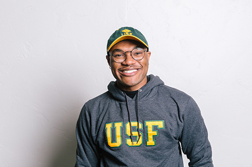 Student wearing USF logo sweater