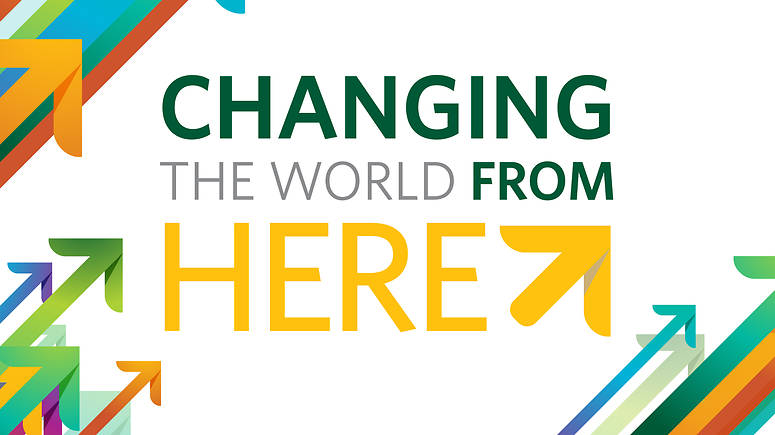 Poster with the text "changing the world from here"