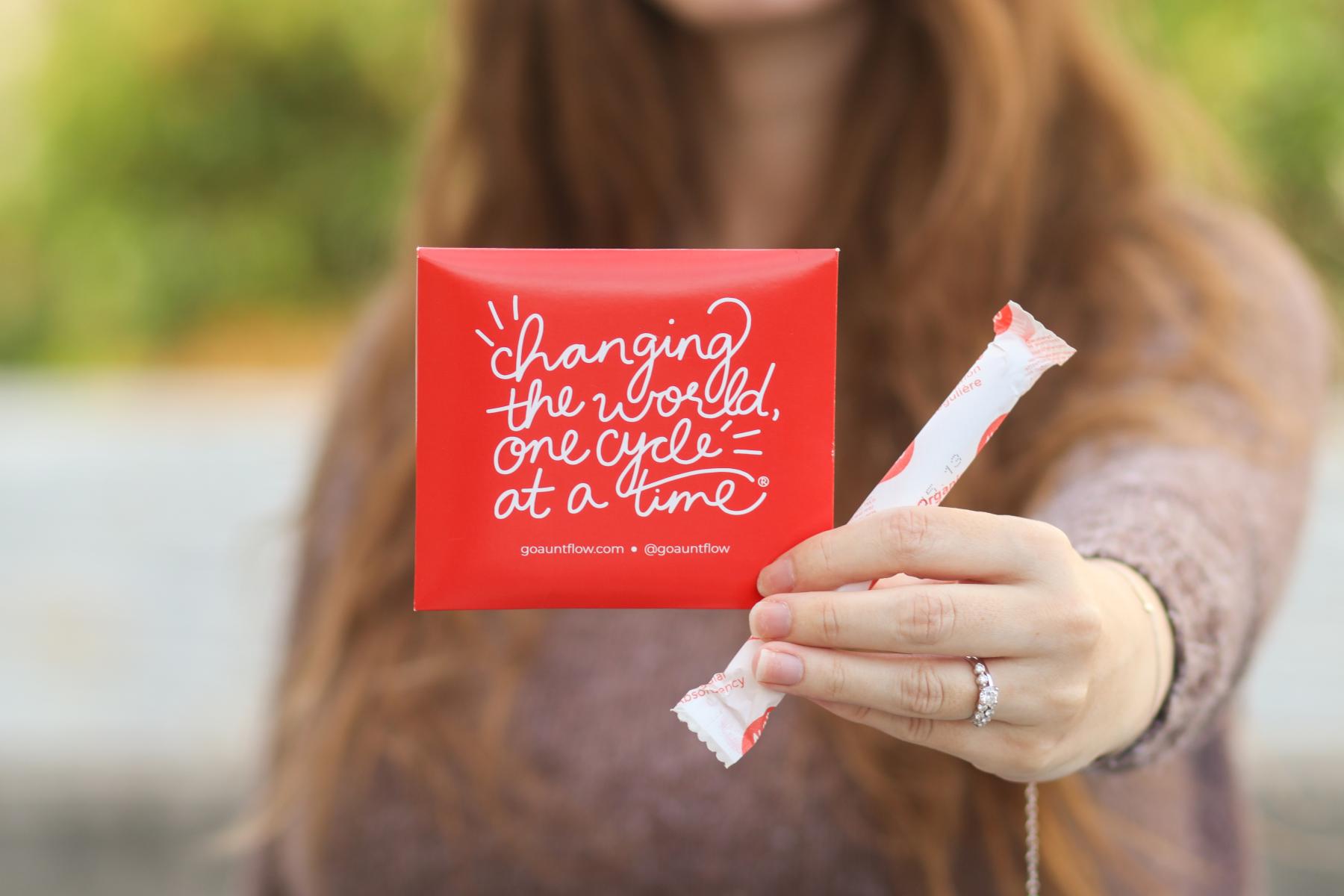 Christina Roby holding her Period. Program Products