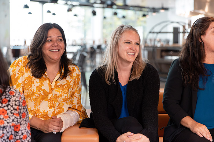 Faculty members engage in conversation at Koret Lodge