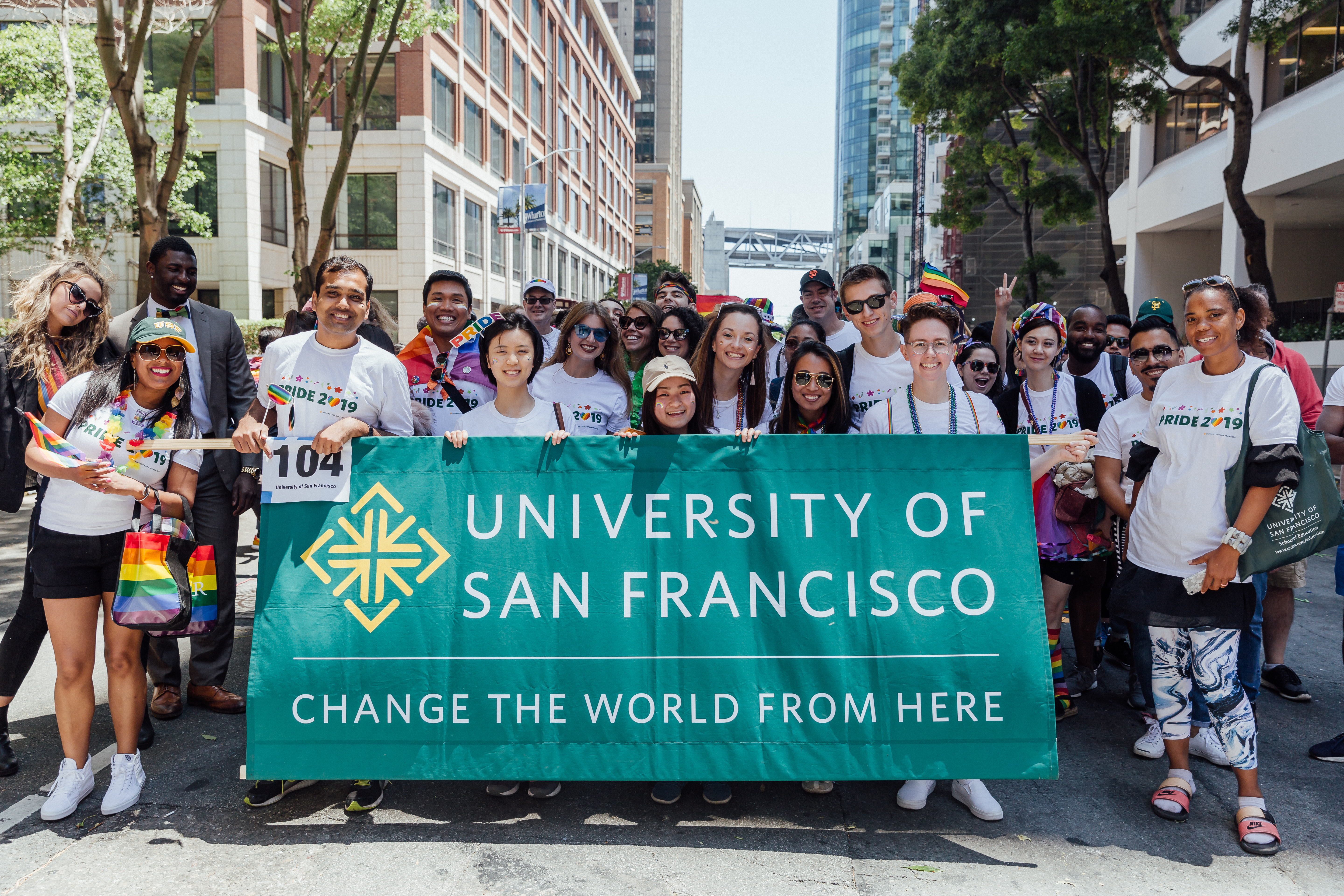 Students holding USF school banner at a parade