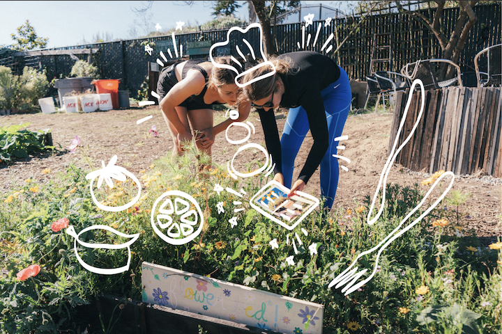 "Two students working in a garden"