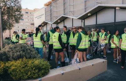 "Group of students picking up trash"