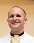 Father Travis Russell