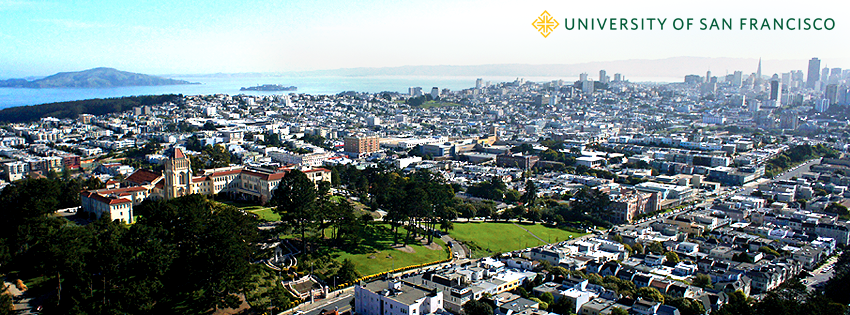 Aerial view of the University of San Francisco with the city in the background.