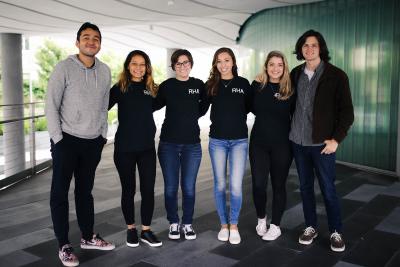 students wearing their organization sweater