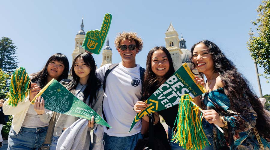 Students holding signs for USF