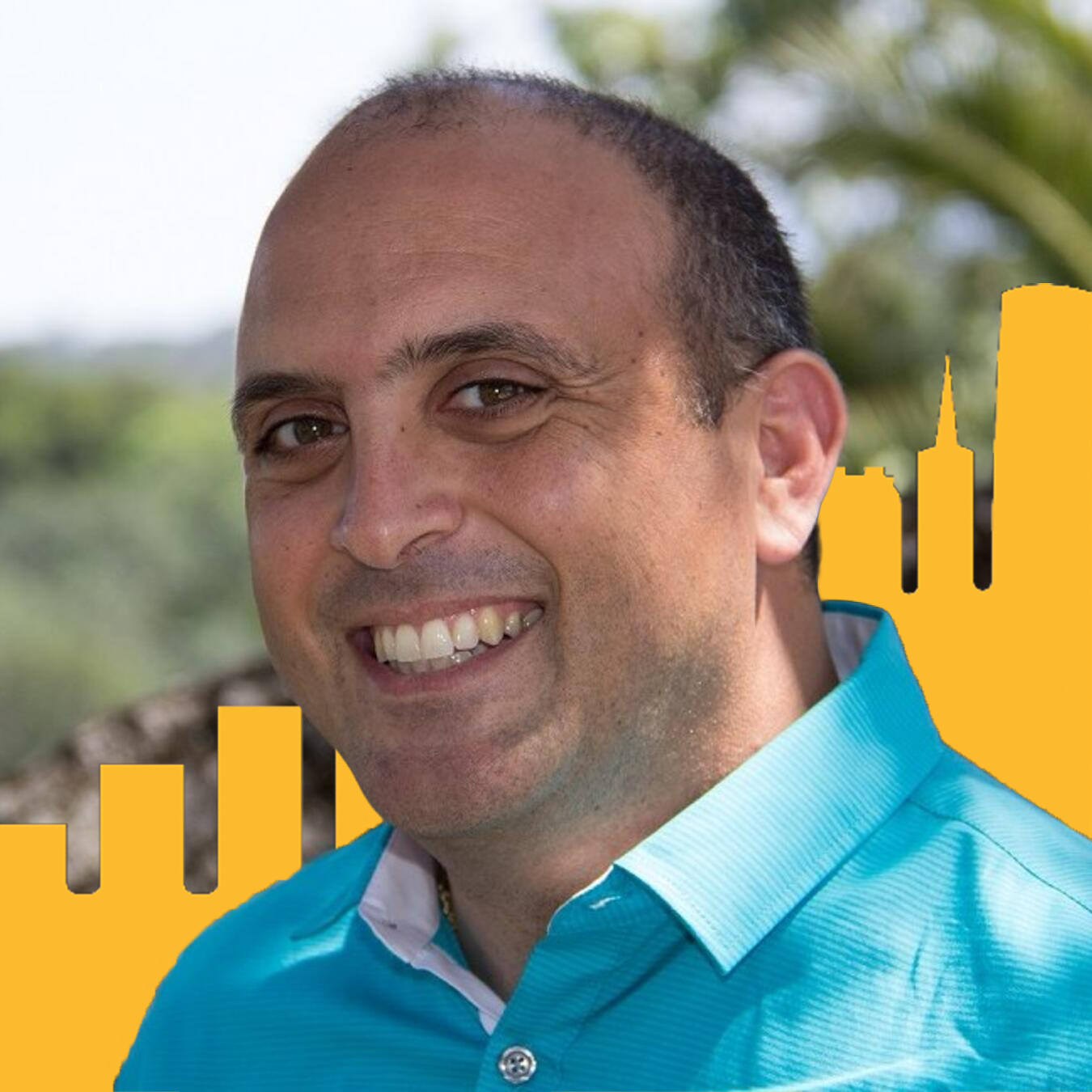 Headshot of David Saah with yellow buildings in the background