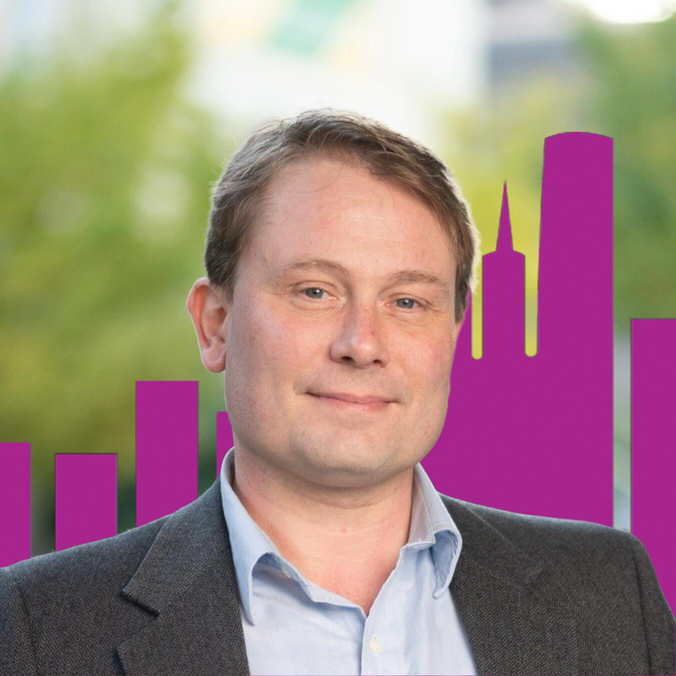 Headshot of Jesse Anttila-Hughes with purple buildings and trees in the background