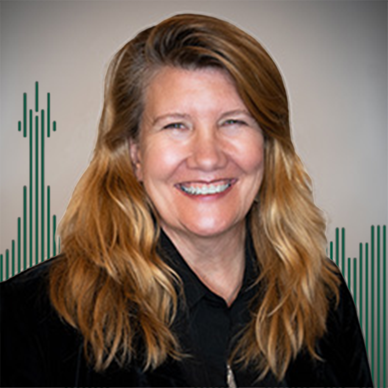 Headshot of Karin Cotterman with green lined buildings behind in the background