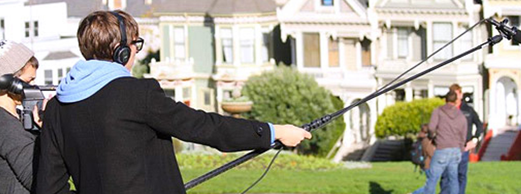 Students filming in Alamo Square park