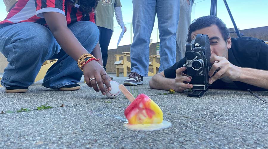 Students with film camera