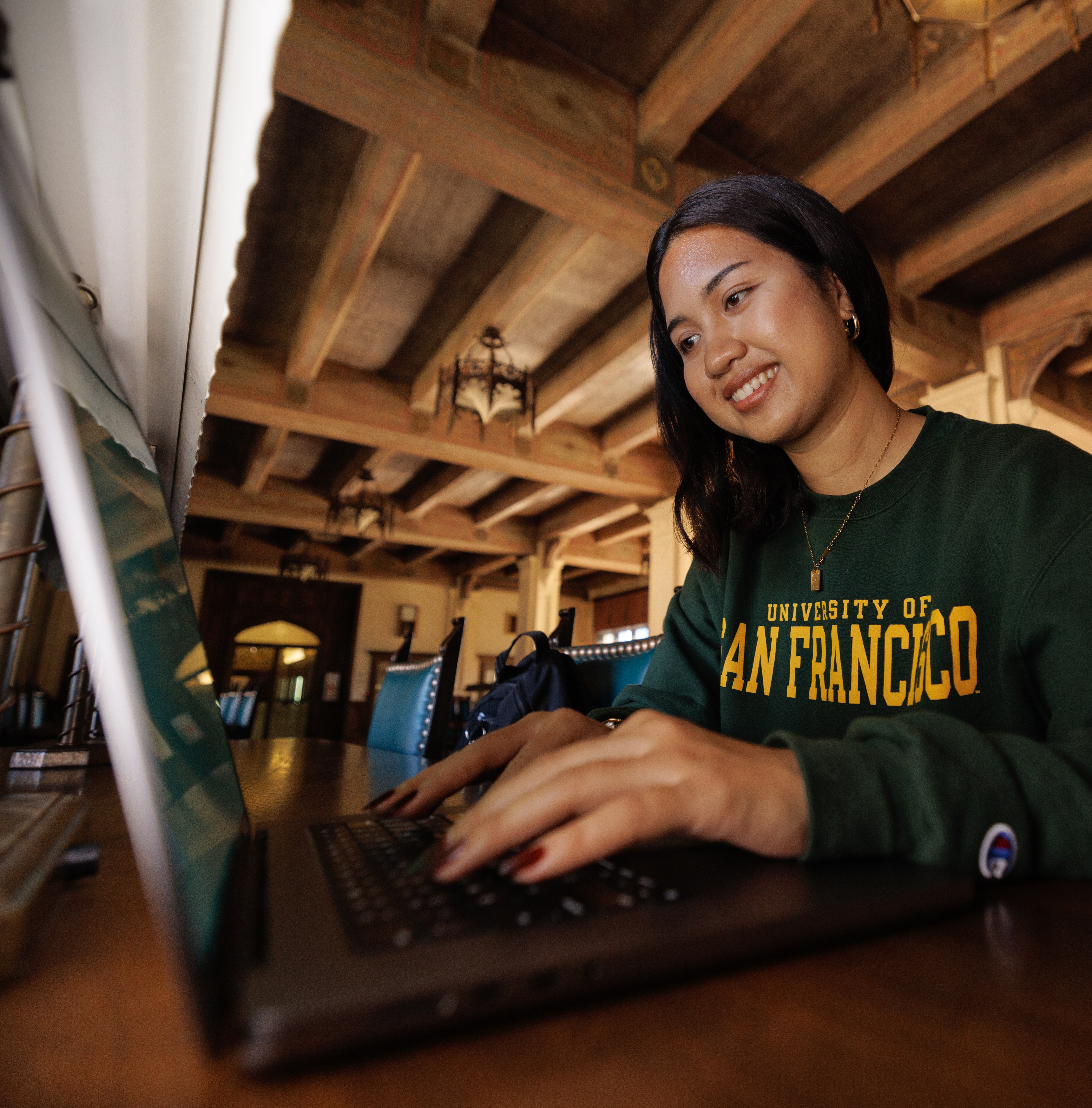 USF student working on laptop