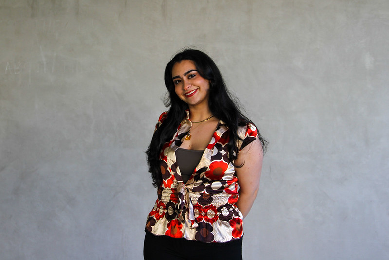 Vice President of Finance, Beth, smiling with hands behind back