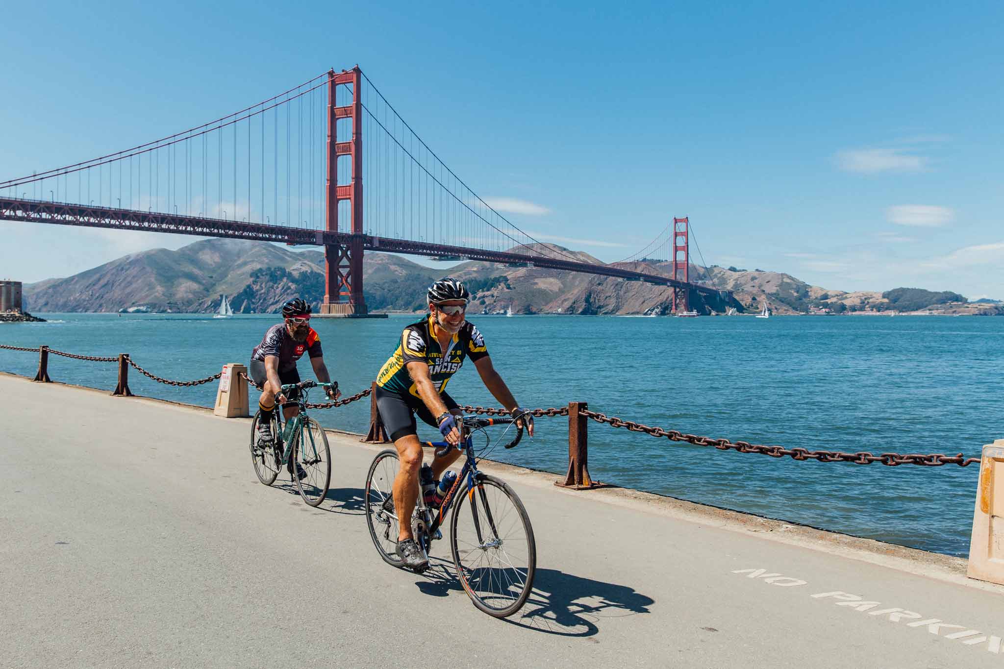 people biking near Golden Gate Bridge