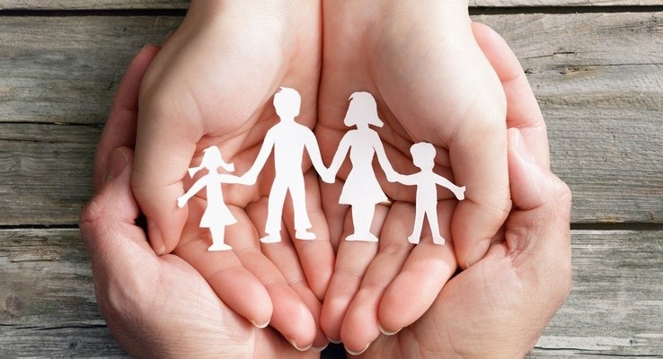 hands holding paper family
