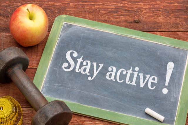 stay active sign next to weight and apple