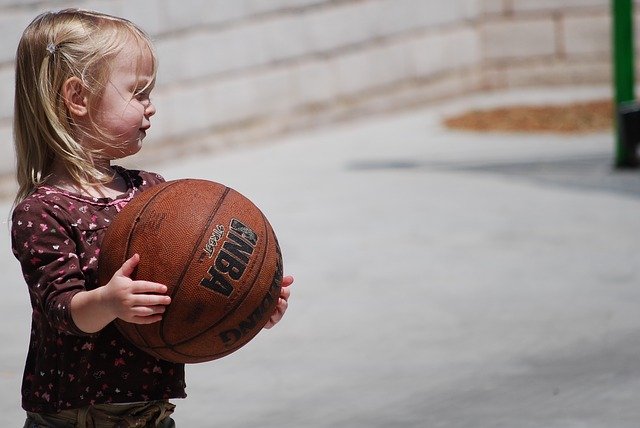 child with basketball