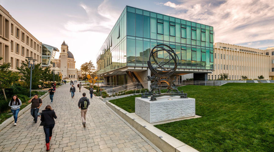 Students walking by Lo Schiavo Center for Science and Innovation building