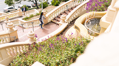 Student walking the Lone Mountain stairs