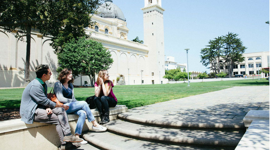 Students sitting in Gleeson Plaza