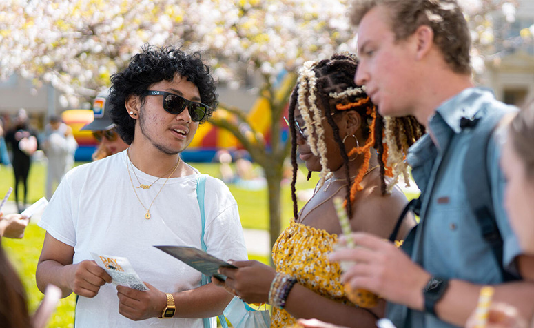 USF students chatting with each other outside