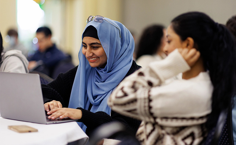 Students working on a laptop