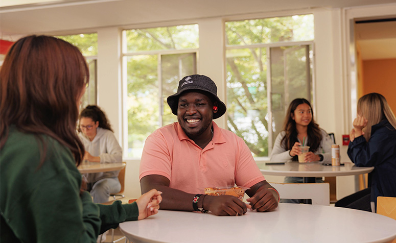 USF student smiling in the cafeteria