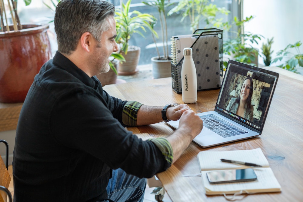 A person in a video call on their laptop