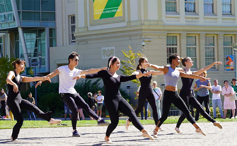 Dancers performing outside Gleeson Library