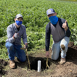Jesse and AJ at star route farms with soil probe