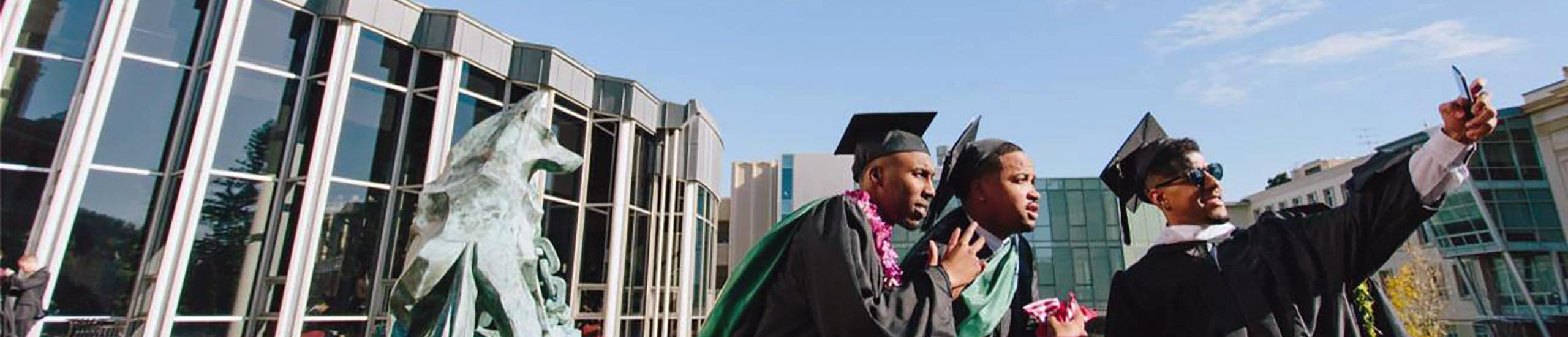 BASE students in caps and gowns.