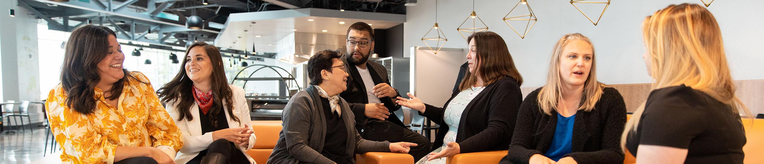Faculty chatting in Koret Lodge