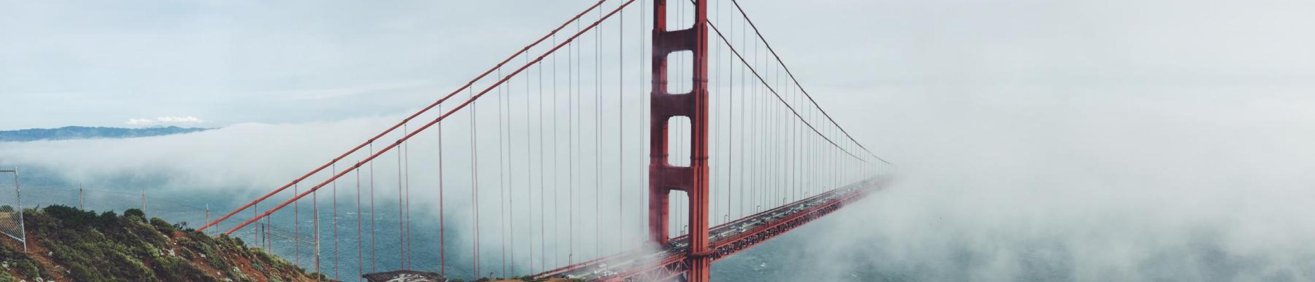 golden gate bridge covered in fog