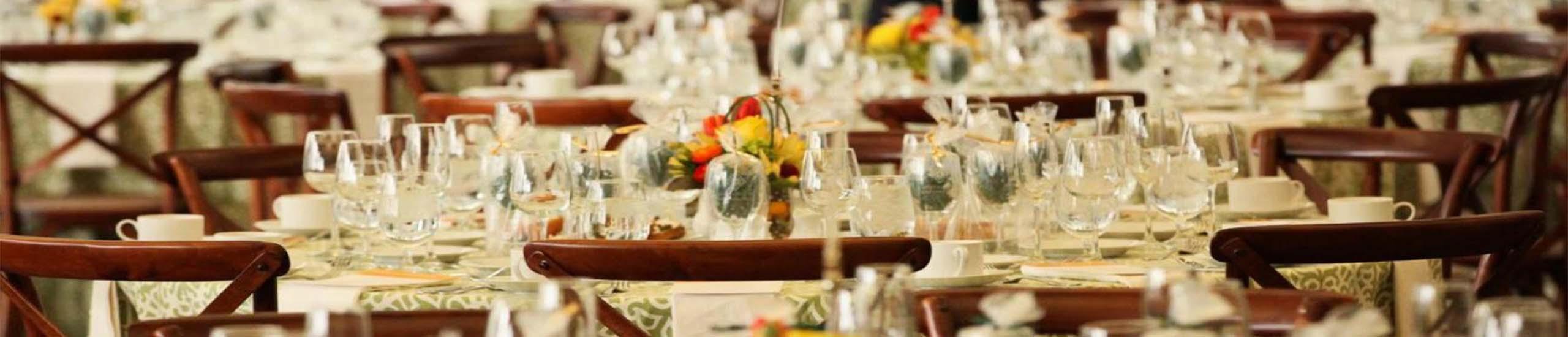 Silverware and plates on a round table at an event