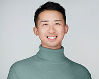 Yih Ren, a cismale graduate intern's smiling headshot