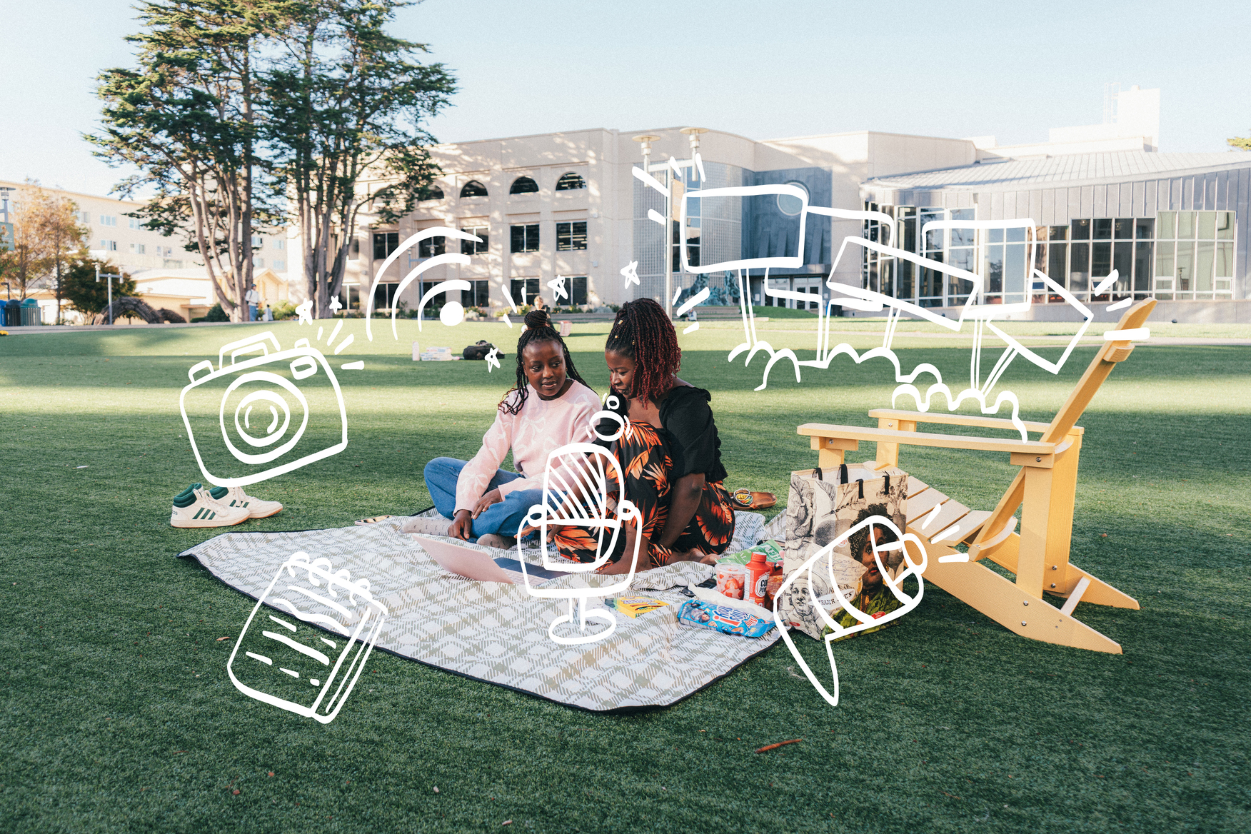 Two students talking on the grass field at USF