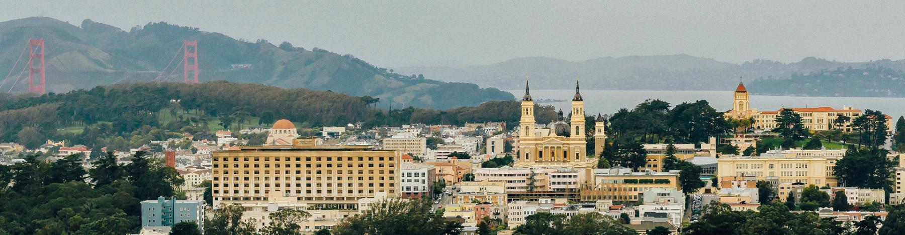 Aerial photo of campus with Golden Gate bridge in background