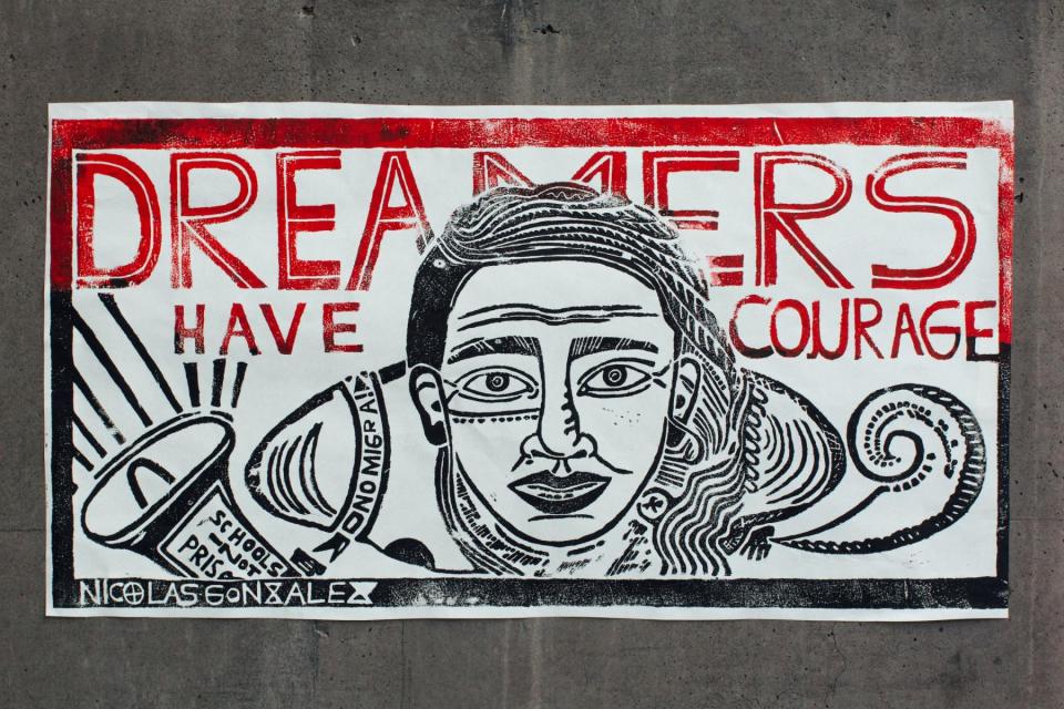 Sign reading dreamers have courage