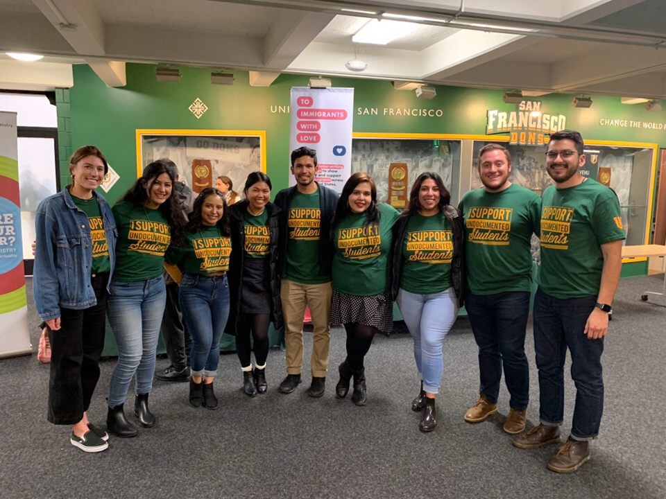 students and staff wearing t-shirts that read Support Undocumented Students