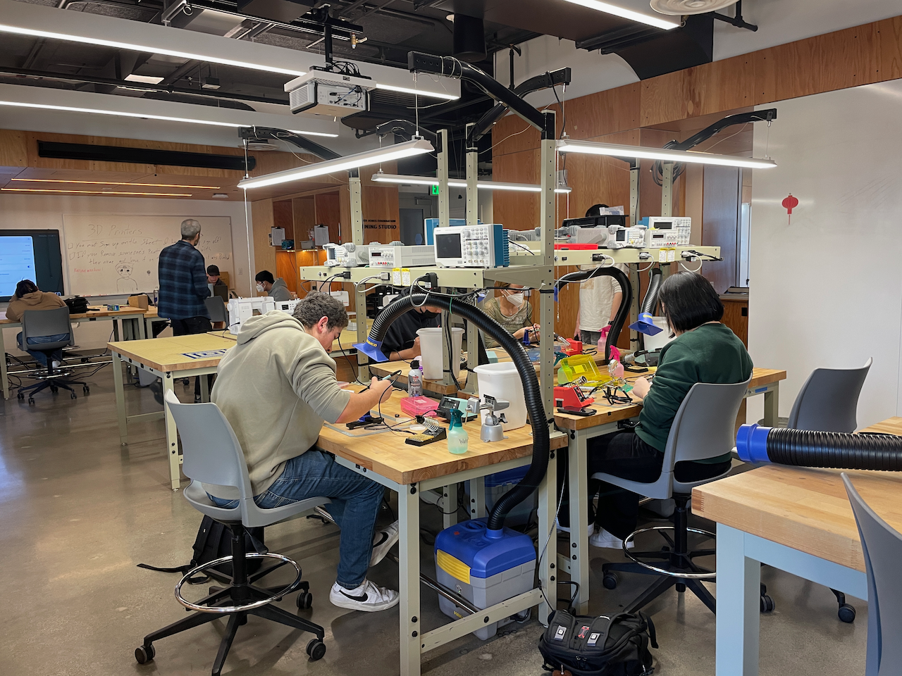 Students working at soldering benches
